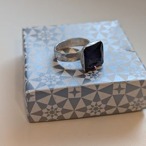 Silver ring with amethyst colored stone